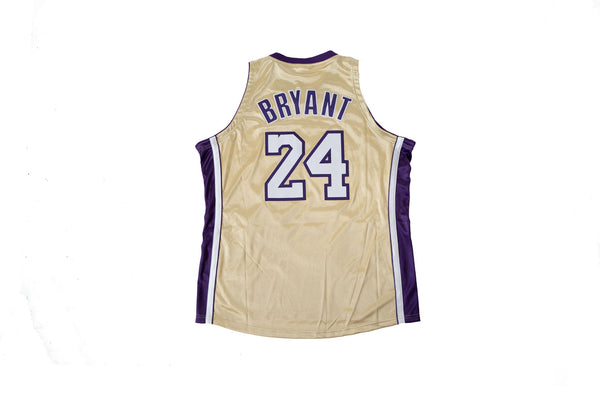 NBA - Kobe Bryant #24 of the Los Angeles Lakers adjusts his jersey